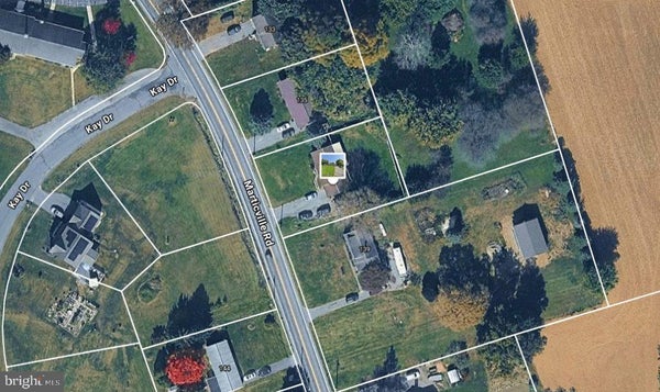 Wide aerial view of 137 Marticville Road and neighboring lots