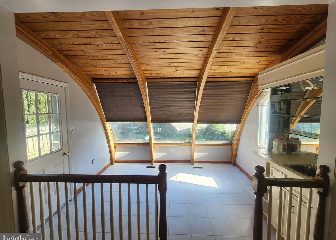 Wood-paneled upper level at 3228 Pinewyn Circle